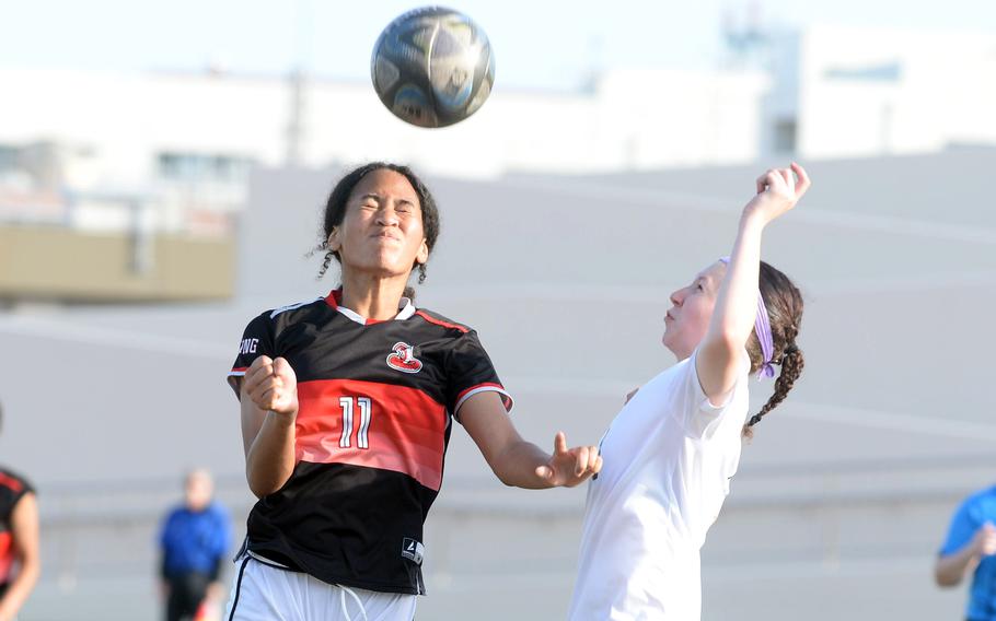 Aniah Little heads the ball.