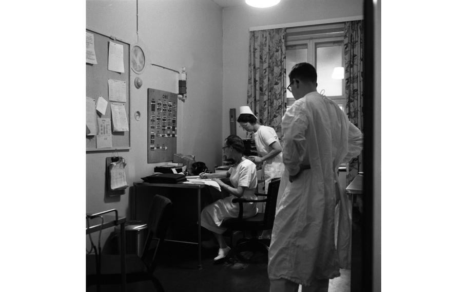 Chief nurse Maj. Ruth Steenburgh (standing in back) and an unidentified nurse and doctor at the 97th U.S. Army Hospital in Frankfurt.