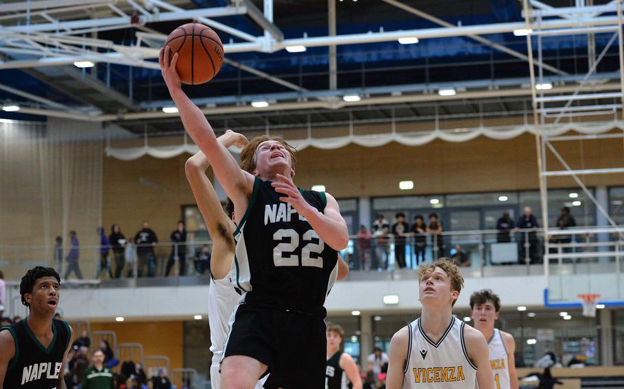 Naples’ Camden Kasparek gets past the Vicenza defense in the boys Division II final at the DODEA-Europe basketball championships in Wiesbaden, Germany, Feb. 17, 2024. Vicenza took the division crown, defeating the Wildcats 76-37.