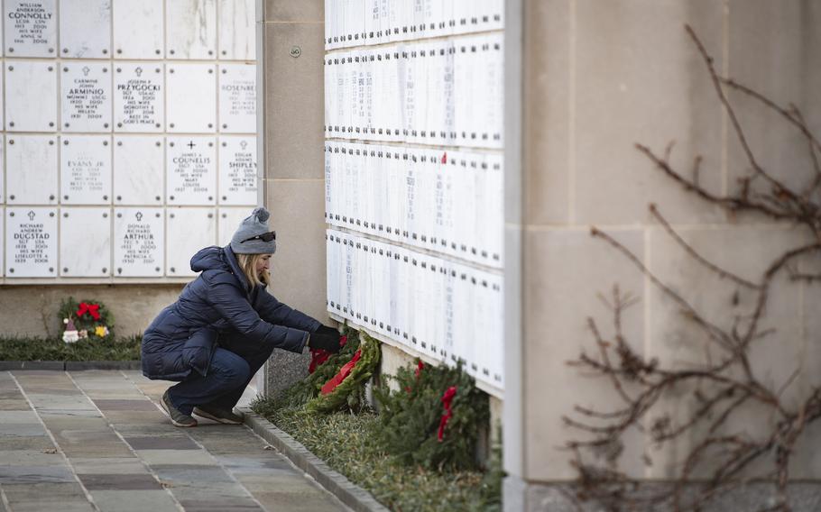 Volunteers participate in the 32nd Wreaths Across America Day in Columbarium Court 5 at Arlington National Cemetery, Arlington, Va., Dec. 16, 2023. 