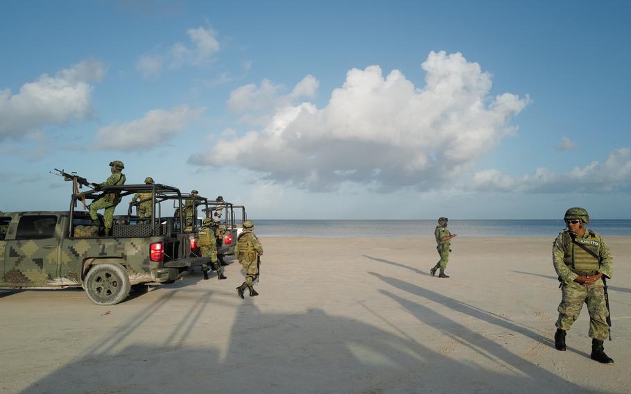 Members of the newly created Tourist Security Battalion, affiliated with Mexico’s National Guard prepare to launch an operation on the outskirts of Cancún. 