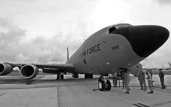Andersen Air Force Base, Sep. 19, 2014: A KC-135 crew offloads after a mission at Andersen Air Force Base, Guam, during an exercise. 

META TAGS: Pacific; U.S. Air Force; KC-135; Stratotanker