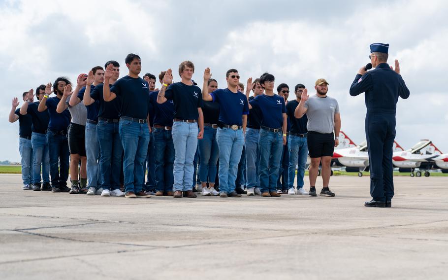 U.S. Air Force Lt. Col. Nathan Malafa, Thunderbirds commander/leader and Thunderbird #1, administers the oath of enlistment to Air and Space Force recruits in the San Antonio delayed-entry program during The Great Texas Airshow, at Joint Base San Antonio-Randolph, Texas, Saturday, April 6, 2024. 
