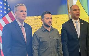 In this photo provided to the Associated Press, Ukrainian President Volodymyr Zelenskyy, center, poses for a photo with House Speaker Kevin McCarthy of Calif., left, and House Minority Leader Hakeem Jeffries of N.Y., at a closed-door meeting with members of Congress on Capitol Hill in Washington, Thursday, Sept. 21, 2023.
