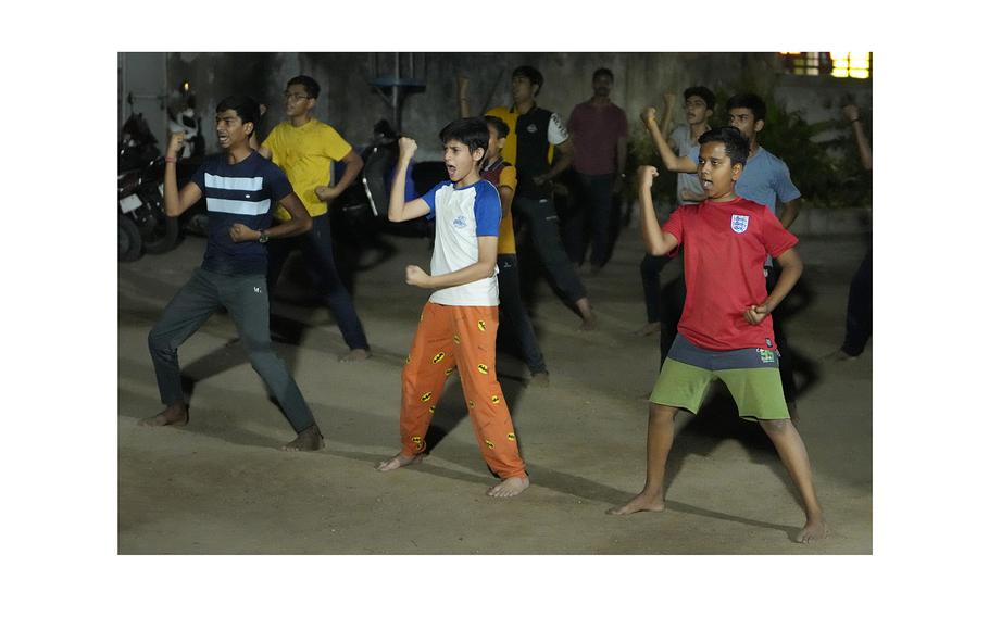 A group of youths participate in the Hindu nationalist organization Rashtriya Swayamsevak Sangh‘s shakha in Ahmedabad, India, April 8, 2024. Shakhas, or local units, induct boys by combining religious education with self-defense skills and games. 