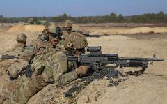 An Assistant Gunner shouts commands to his M240 Gunner while engaging targets during a combined arms live fire exercise involving Paratroopers assigned to the 1st Battalion, 505th Parachute Infantry Regiment, 3rd Brigade Combat Team, 82nd Airborne Division and Polish Soldiers with the 19th Mechanized Brigade. The 3rd Brigade Combat Team, 82nd Airborne Division is deployed in Poland to assure our Allies and strengthen the NATO Alliance. (U.S. Army Photo by Sgt. Garrett Ty Whitfield)