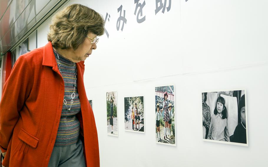 A commuter looks at photos of Megumi Yokota, who was abducted by North Koreans in 1977, at Shinjuku Station in Tokyo, May 9, 2018.