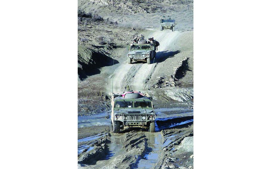A convoy of Humvees from the 1st Battalion, 508th Infantry Regiment travel along what passes for a road in eastern Afghanistan, during a recent two-day mission to the villages of Naka and Zarwuk.