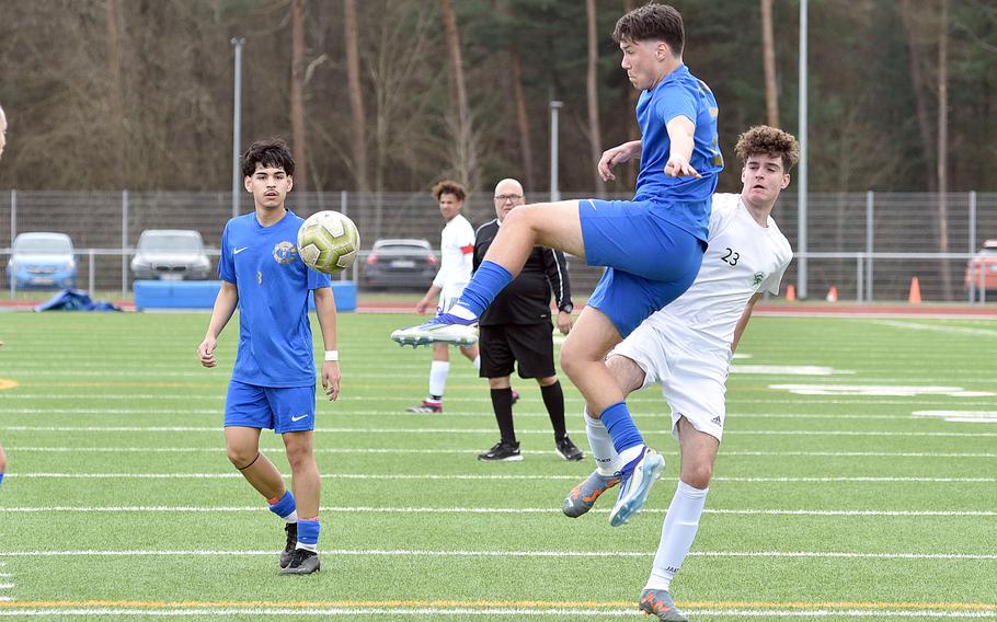 Ramstein center back Mathias Bailey jumps up to his the ball during a match against SHAPE on April 5, 2024, at Ramstein High School on Ramstein Air Base, Germany.