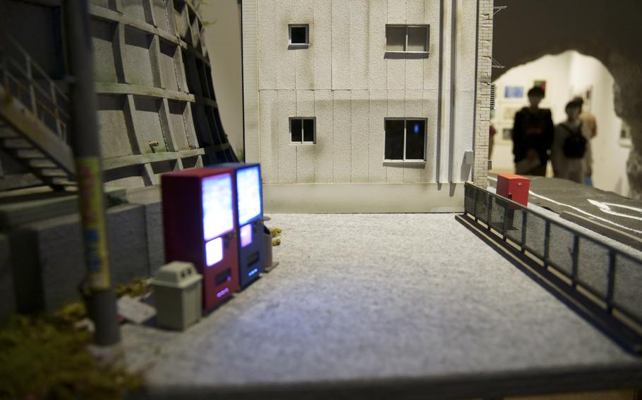 Elaborate dioramas occupy a room at Godzilla the Art, an exhibit commemorating the 70th Anniversary of the movie monster's origin.