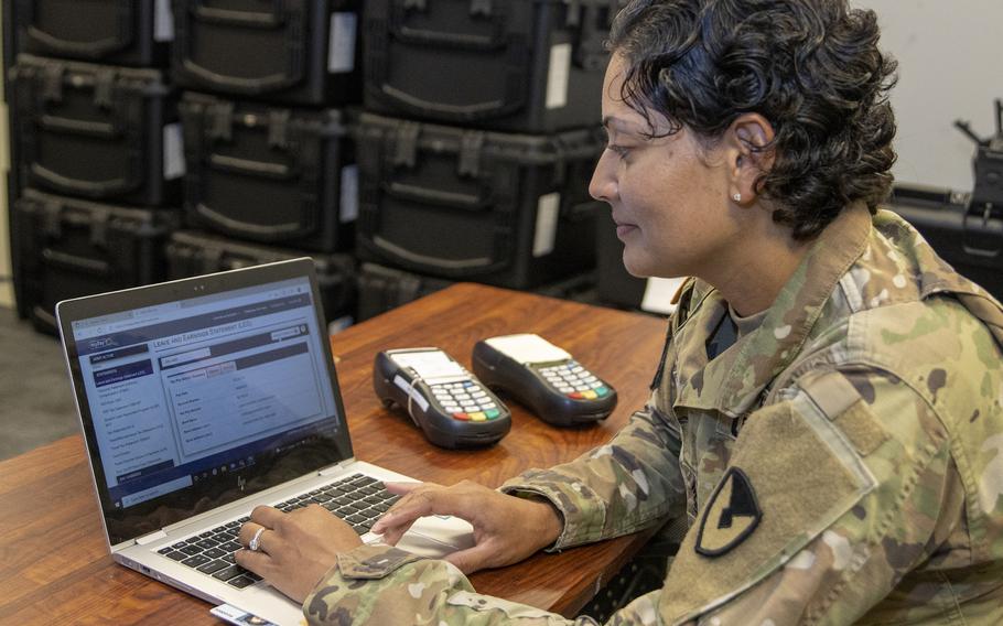 Master Sgt. Eva Miranda Bernard, a U.S. Army Financial Management Command systems instructor, checks her leave and earnings statement on myPay in Indianapolis, July 21, 2022. Much of that information will move to the service’s new Integrated Pay and Personnel System-Army.