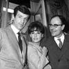 The actors and the director pose for a photo in black and white.