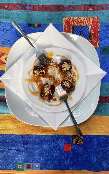 A dessert of dates covered with caramel sauce and chopped almonds at Mama of Africa in Wiesbaden, Germany.