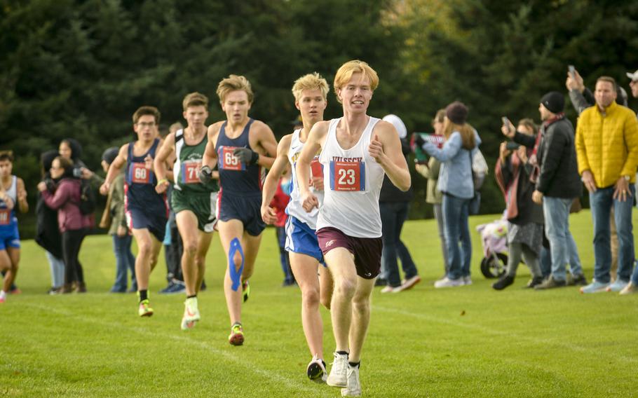 Vilseck senior Jackson Cochran rushes out to an early lead over Wiesbaden junior Luke Jones in the boys DODEA-Europe cross country championship race Oct. 21, 2023, in Baumholder, Germany.