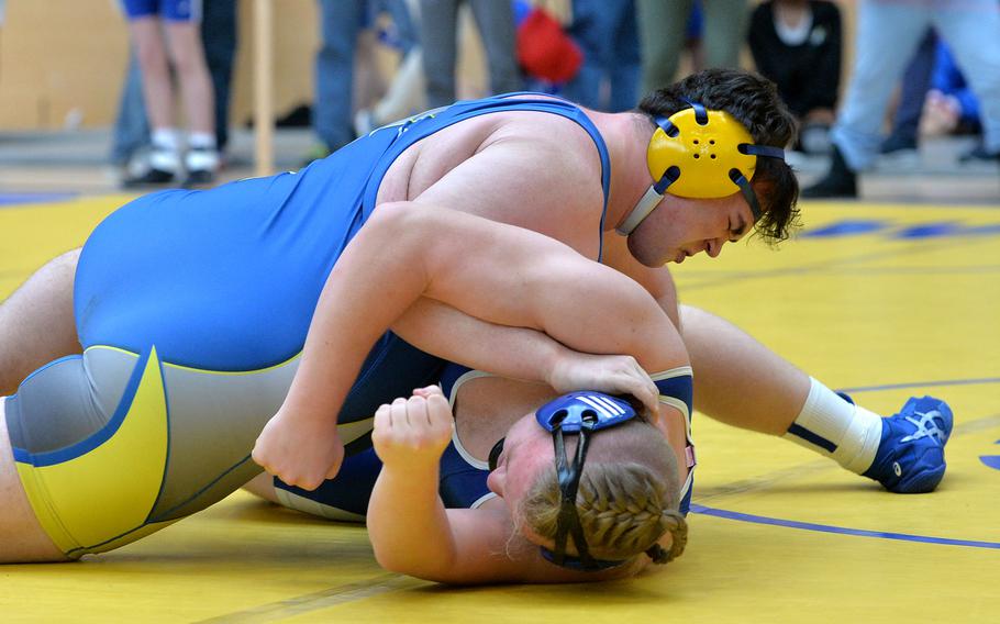 Wiesbaden’s John Ruland, top, beat Rota’s Donovan Lenhard in a 285-pound match on the first day of action at the DODEA-Europe wrestling finals in Wiesbaden, Germany, Feb. 10, 2023. 