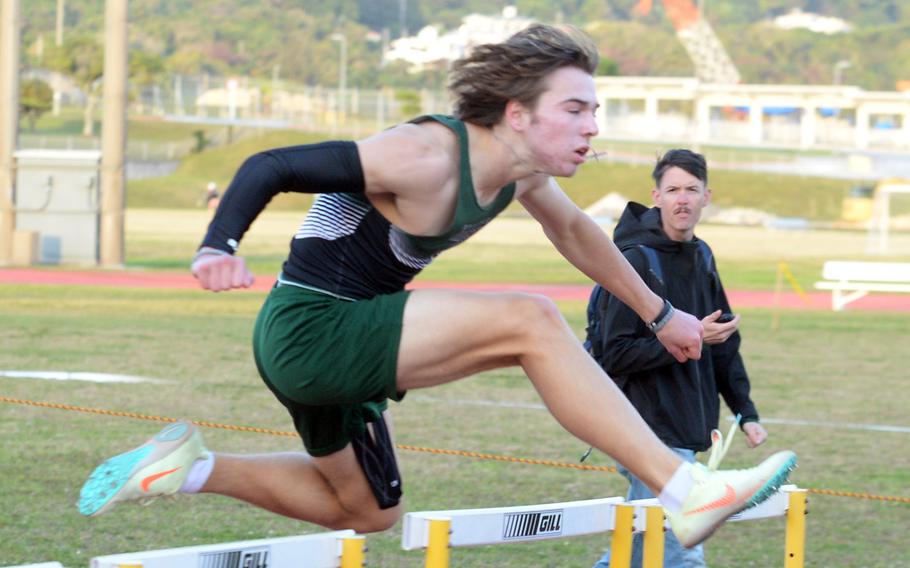 Kubasaki's Caleb Stephan navigates the final hurdles in the 300 hurdles during Wednesday's first day of a two-day DODEA-Okinawa track and field meet. Stephan won in 41.62  seconds.