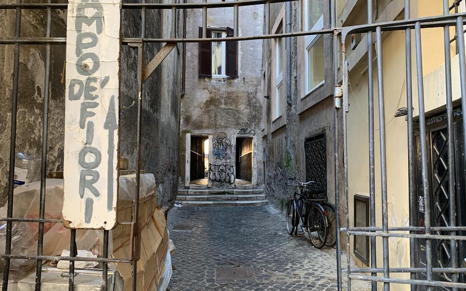 The entrance to Passeto del Biscione in Rome can appear off-putting, but don't  let it keep you from seeing the recently restored frescoes and a shrine to the Madonna. 