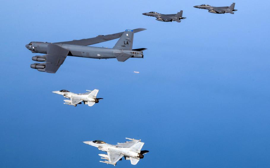 A U.S. Air Force B-52H Stratofortress bomber flies alongside South Korean F-15K Slam Eagles and KF-16s over the Yellow Sea, March 6, 2023.