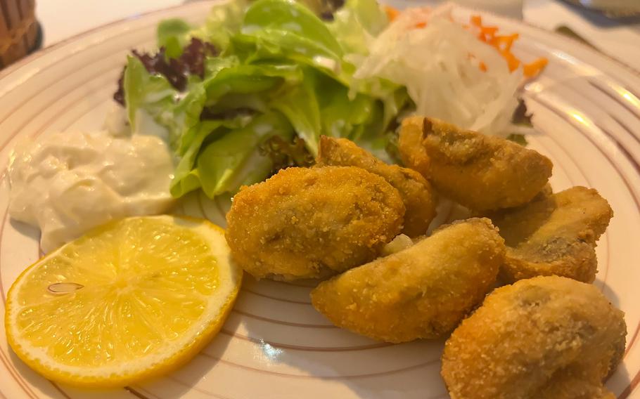 The fried mushroom appetizer at Zur Pfaffschenke in Kaiserslautern, Germany, comes with tartar sauce and a side salad.