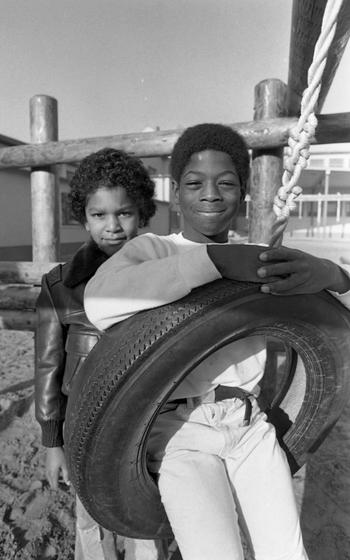 J.T. Williams III (left) and Derek Dixon, 9, pose on the playground. 