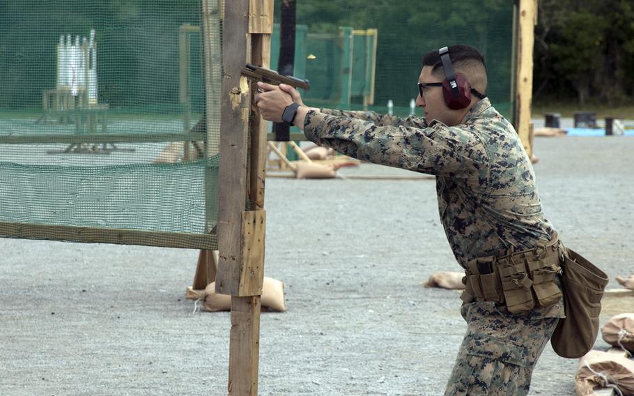 A Marine fires at targets during the Far East Marksmanship Competition at Camp Hansen, Okinawa, Dec. 13, 2022.