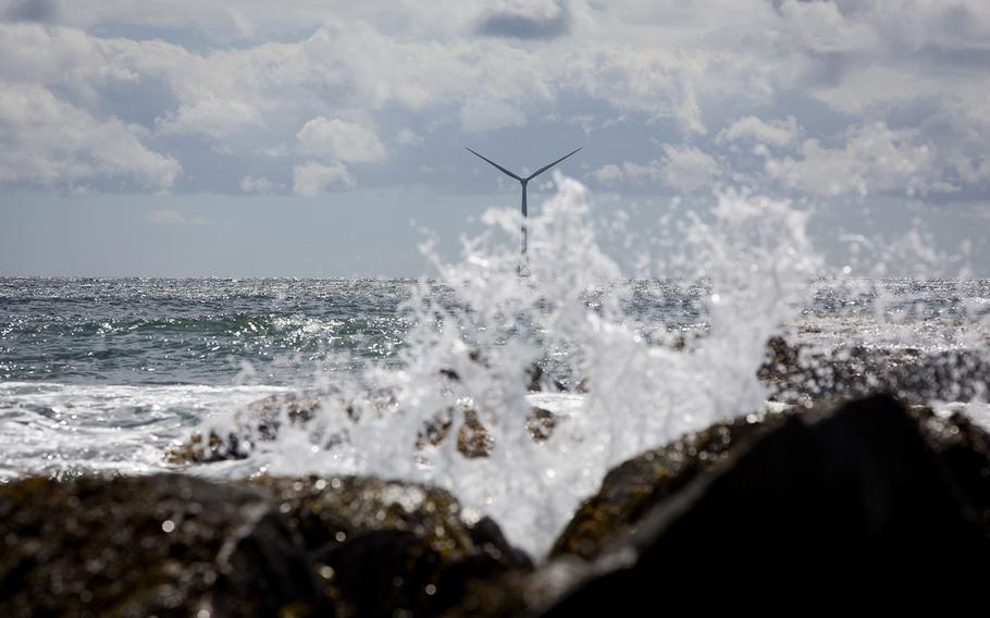 Water splashes on rocks near an Ørsted wind turbine off Block Island, Rhode Island, U.S., on Wednesday, Sept. 14, 2016. 