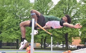 Naples' Fredrick Boateng appears to be clearing 6 feet, 4 inches in the high jump, but ended up knocking down the bar on this attempt. Still, he cleared 6-2 to put up the top mark in DODEA-Europe this season.

Kent Harris/Stars and Stripes