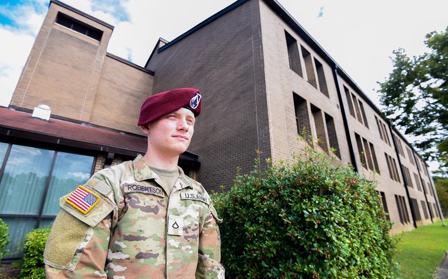 Army Pfc. Austin Robertson is one of about 1,200 soldiers moving out of Fort Bragg’s condemned Smoke Bomb Hill barracks this month after Army leaders decided to shutter the quarters at the North Carolina base plagued with mold and other issues. Robertson expected to move soon into the barracks that he stands in front of in this Sept. 8, 2022, photo. 