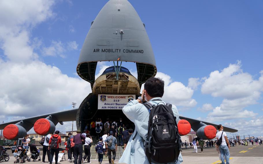 People check out an Air Force C-5 Galaxy during the Friendship Festival at Yokota Air Base, Japan, Sunday, May 22, 2022.