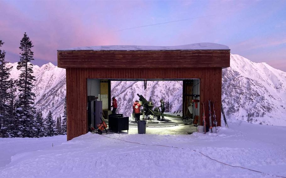 Utah Department of Transportation workers prepare to fire a howitzer at a mountain in Little Cottonwood Canyon in Salt Lake Valley earlier this month.