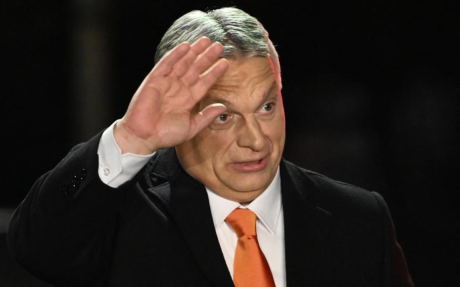 Hungarian Prime Minister Viktor Orban celebrates on stage with members of the Fidesz party at their election base, “Balna” building on the bank of the Danube River of Budapest, on April 3, 2022. 