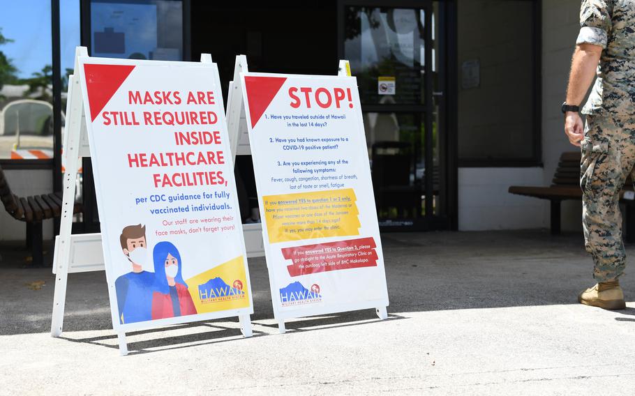 Informational signs about COVID-19 are placed outside Branch Health Clinic Makalapa in Hawaii on Aug. 4, 2021. 