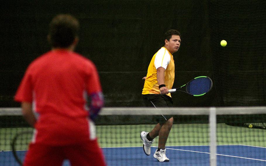 Bahrain’s Mathew Mendoza tries a drop shot during a match between himself and teammate Carson Owens and Lakenheath’s Jonathan Soito and Calvin Moncada in pool-play action of the DODEA European tennis championships on Oct. 19, 2023, at T2 Sports Health Club in Wiesbaden, Germany.