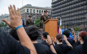 A man speaks at a military ceremony.