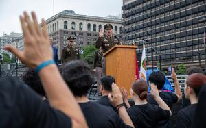 A man speaks at a military ceremony.
