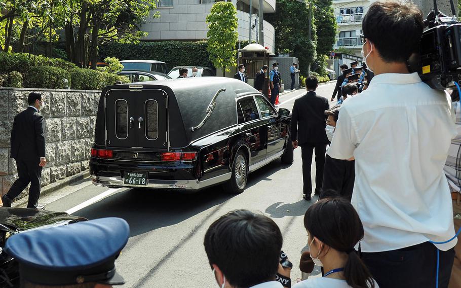 A hearse leaves the residence of former Japanese Prime Minister Shinzo Abe to transport his body to Zojoji temple in Tokyo on July 11, 2022. Abe, Japan’s longest-serving prime minister, was fatally shot during a campaign stop on July 8 in an exceedingly rare gun crime in one of the world’s safest countries. 