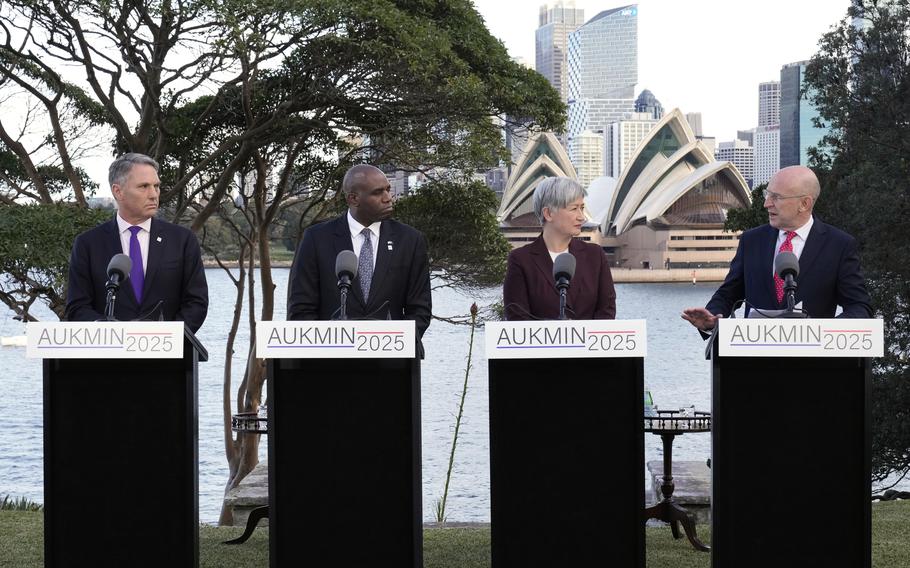 Australian Deputy Prime Minister Richard Marles, from left, Britain’s Secretary of State for Foreign, Commonwealth and Development Affairs David Lammy, Australian Foreign Minister Penny Wong and Britain’s Secretary of State for Defence John Healey speaking to the press.