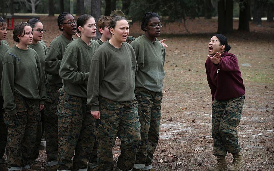 A drill instructor shouts instructions at her Marine recruits during training in boot camp February 27, 2013 at MCRD Parris Island, South Carolina.