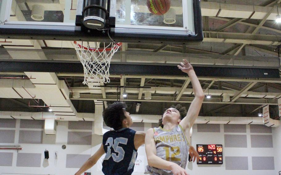 Humphreys' Elijah Kidd shoots against Chadwick's Chris Kang during Wednesday's Korea boys basketball game. The Blackhawks won 87-62.