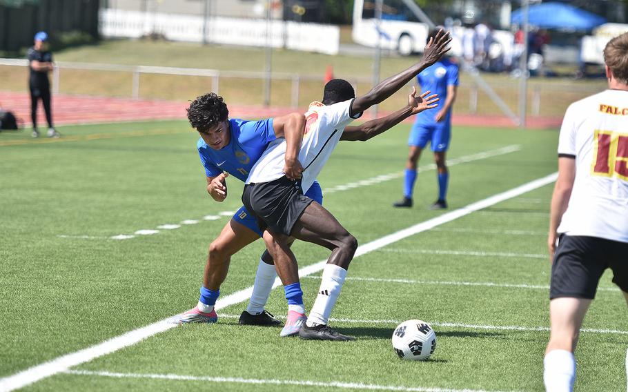 Ramstein's Santiago Idaragga and Vilseck's Dominic Atambila try to keep each other from the ball Monday, May 19, 2025, at the DODEA-Europe Division I boys soccer championships in Kaiserslautern, Germany.