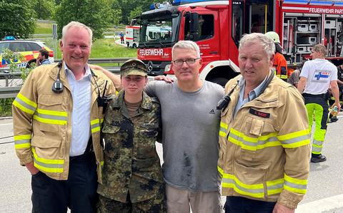 Army Col. Charles Bergman, second from right, was one of the first on the scene June 3, 2022, at a catastrophic train derailment near Garmisch-Partenkirchen, Germany, that killed five people and injured more than 40. He spent 90 minutes helping rescue survivors and credited his Army training for equipping him to take charge of the situation. Here he poses with other rescuers.