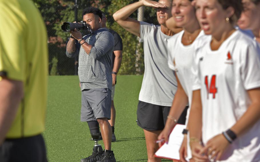 Jae Terry takes photos during a recent McDonogh soccer game. “You can look at a single picture and see a certain movement or expression that paints a unique picture for me. I want to give that back to all the girls,” he said. 