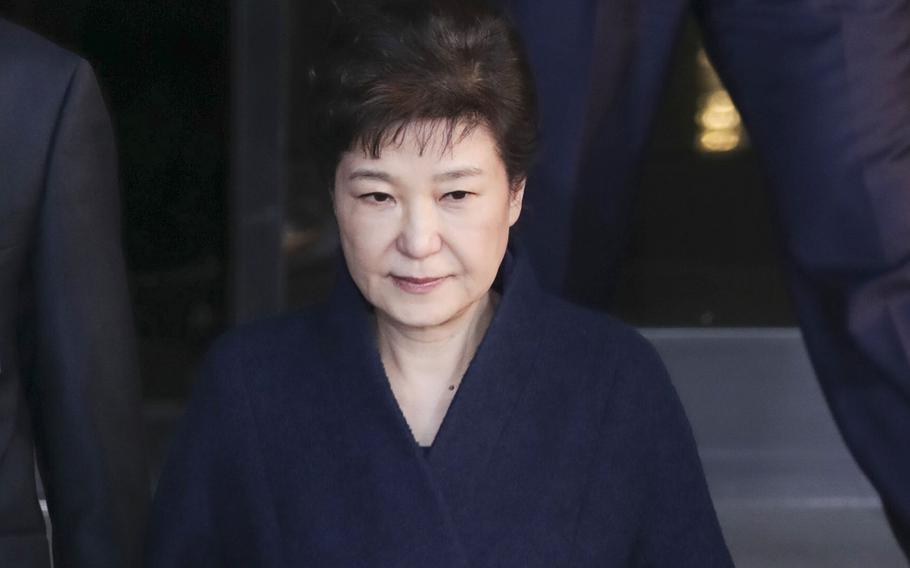 Former South Korean President Park Geun-hye leaves the prosecutors office on March 22, 2017 in Seoul. South Korean President Moon Jae-in said Friday, Dec. 24, 2021, that Park would be pardoned and released from prison on Dec. 31.