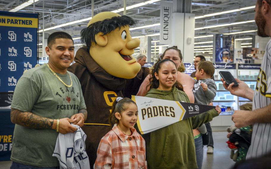 The San Diego Padres' mascot, Swinging Friar, poses with fans inside the main exchange at Camp Humphreys, South Korea, March 17, 2024.