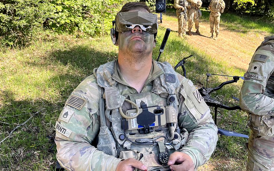 A soldier flies a first-person-view drone