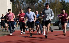 Members of the 86th Security Forces Squadron run at Ramstein Air Base, Germany, April 20, 2022. Allegations that a senior noncommissioned officer from the unit offered a  bribe to pass a physical training test were determined to be false, base officials said.