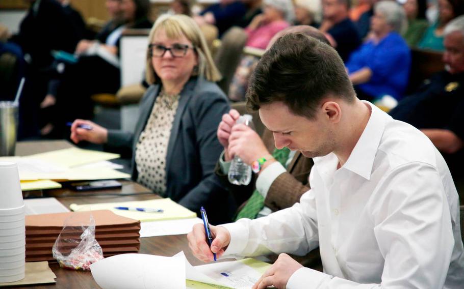Defendant Gene Alexzander Scott, right, sits at the defense table with his lawyers Kay Boulware, left, and William Frick Tuesday at the Chester County, S.C., Courthouse.