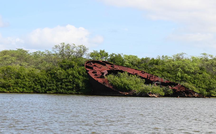 Sailors from Navy Munitions Command, other units and guests on Joint Base Pearl Harbor-Hickam, Hawaii visited the site of the rusting hulk of LST-480 on Waipio Peninsula for a ceremony honoring the 80th Anniversary of the West Loch Disaster May 21, 2024. 