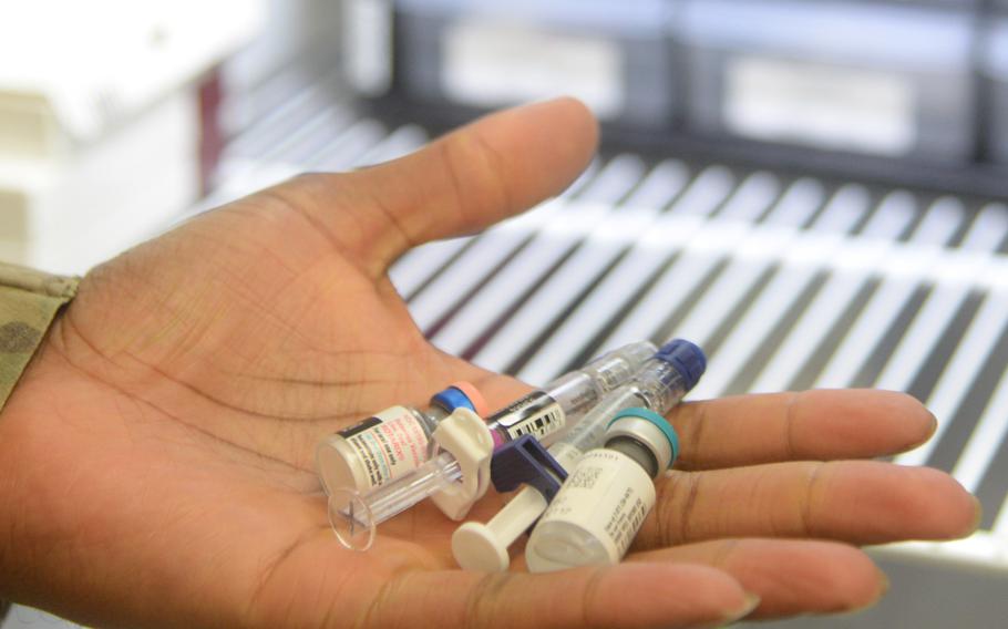 Medical personnel show commonly administered vaccines at Malmstrom Air Force Base, Mont. 