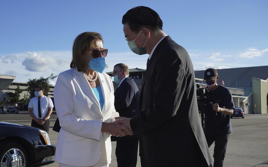 In this photo released by Taiwan's Ministry of Foreign Affairs, U.S. House Speaker Nancy Pelosi, left, speaks with Taiwan's Foreign Minister Joseph Wu as she prepares to leave in Taipei, Taiwan, Wednesday, Aug. 3, 2022.